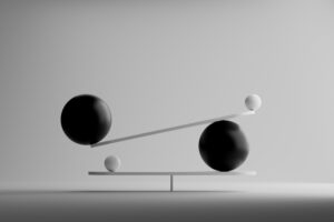 Abstract figures suggesting balance. Using provisional patent applications is about finding the right balance.